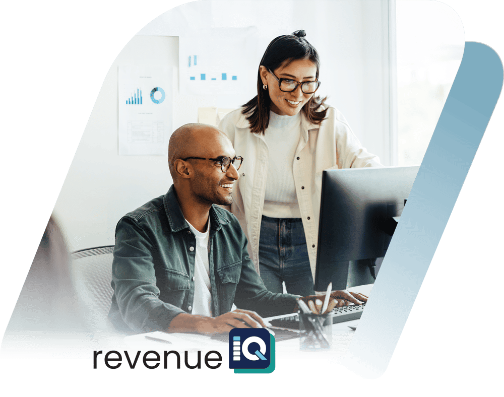 Man and woman smiling in front of desktop with overlay logo RevenueIQ